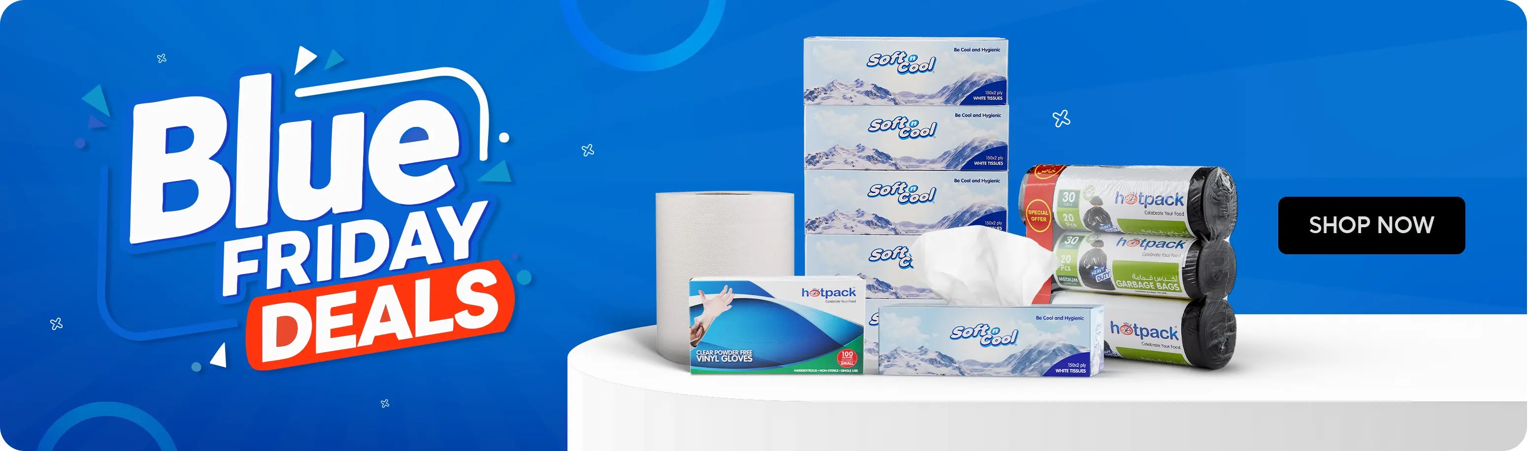Blue Friday Deals banner – vibrant blue background featuring bold “Blue Friday Deals” text. On the right side, a display of Hotpack and Soft n Cool essentials including facial tissues, tissue rolls, vinyl gloves, garbage bags, and boxed white tissues arranged on a white podium.لافتة عروض الجمعة الزرقاء – خلفية زرقاء لامعة مع نص بارز “عروض الجمعة الزرقاء”. على الجهة اليمنى تظهر مجموعة من منتجات هوت باك وسوفـت آند كول تشمل مناديل وجه، رول مناديل، قفازات فينيل، أكياس نفايات، وعلب مناديل بيضاء موضوعة على منصة بيضاء.