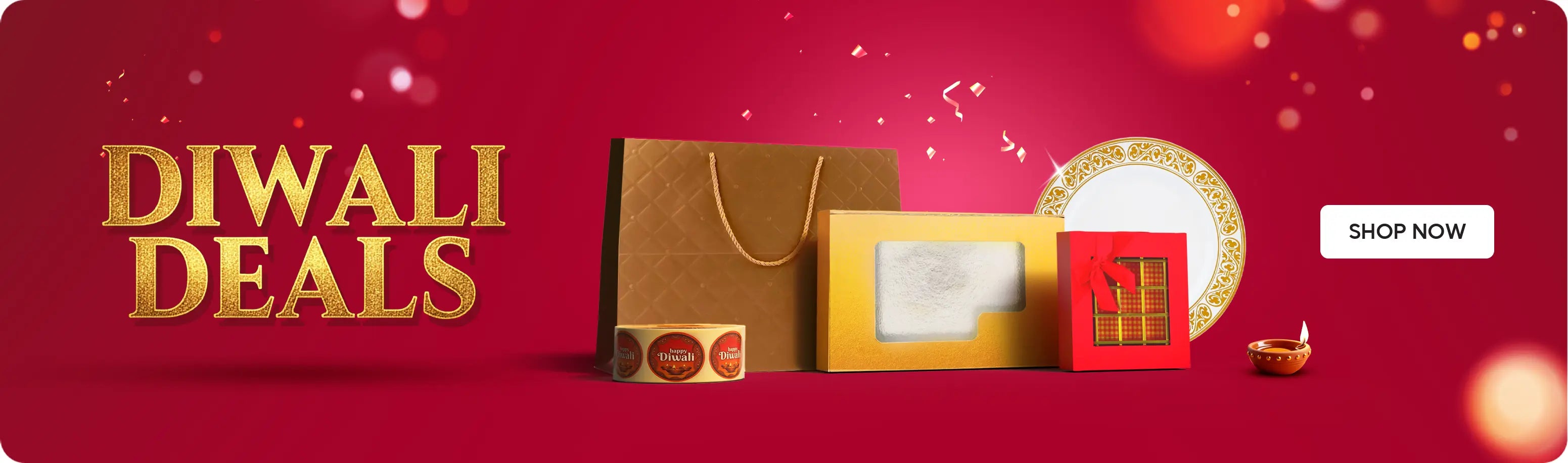 Diwali Deals – festive red banner with gift boxes, golden bag, and a Shop Now button. عروض ديوالي – لافتة احتفالية باللون الأحمر مع صناديق هدايا وحقيبة ذهبية وزر تسوق الآن.