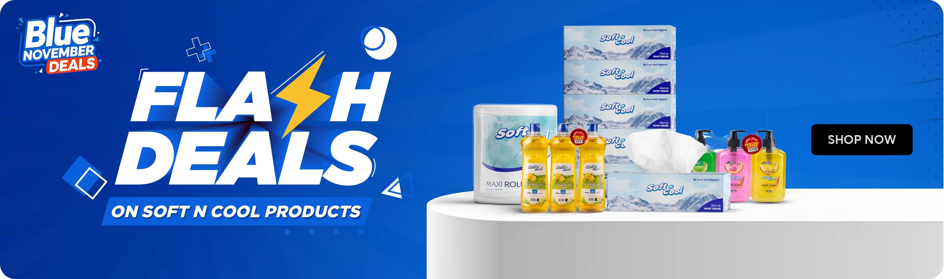 Blue November Flash Deals banner – blue-themed design featuring the text “Blue November Deals” and “Flash Deals on Soft N Cool Products” with a lightning bolt graphic. Displayed on a white podium are various Soft N Cool products including tissue boxes, wet wipes, and liquid soap bottles. لافتة عروض نوفمبر الزرقاء – تصميم باللون الأزرق يحتوي على عبارة 