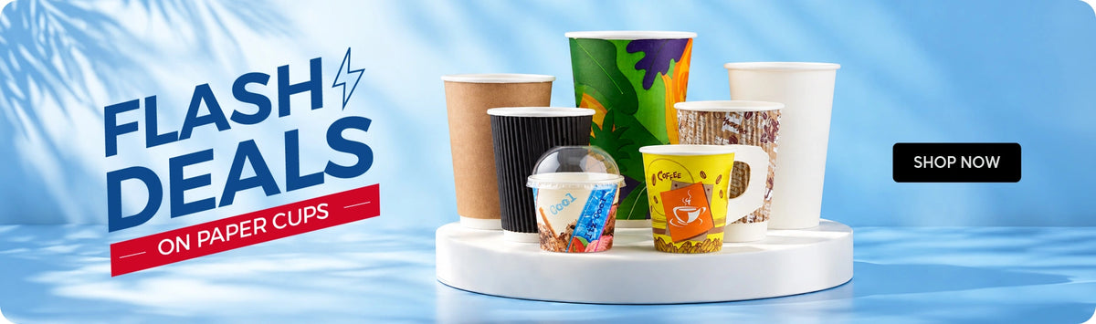 Flash Deals on Paper Cups banner featuring a variety of Hotpack disposable paper cups including ripple wall cup, black ripple cup, printed cold cup with dome lid, colorful printed tall cup, coffee mug, and plain white cup displayed on a white platform against a light blue background with palm leaf shadows and Shop Now call to action. | بانر عروض سريعة على الأكواب الورقية يعرض مجموعة متنوعة من أكواب هوت باك الورقية للاستخدام مرة واحدة تشمل كوب ريبل، كوب ريبل أسود، كوب بارد مطبوع مع غطاء قبة، كوب طويل ملون مطبوع، كوب قهوة، وكوب أبيض سادة معروضة على منصة بيضاء بخلفية زرقاء فاتحة مع ظلال أوراق النخيل وزر تسوق الآن.