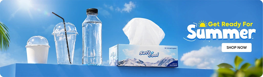 Get Ready for Summer banner featuring Soft & Cool white tissues box alongside disposable clear dome cups and a water bottle displayed on a blue platform against a bright summer sky background with Shop Now call to action. | بانر الاستعداد لفصل الصيف يعرض علبة مناديل سوفت آند كول البيضاء مع أكواب شفافة ذات غطاء قبة وزجاجة ماء معروضة على منصة زرقاء بخلفية سماء صيفية مشرقة مع زر تسوق الآن.