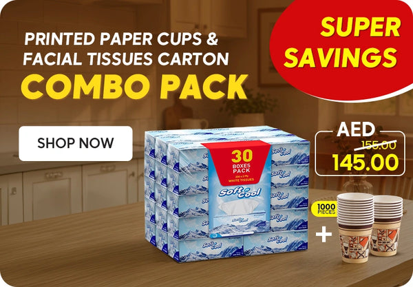 Super Savings Combo Pack banner featuring Soft & Cool facial tissue 30 boxes pack and Hotpack printed paper cups 1000 pieces bundle priced at AED 145.00 down from AED 155.00 displayed on a warm wooden table background with Shop Now call to action. | بانر عبوة كرتونية مشتركة توفير كبير يعرض كرتون مناديل وجه سوفت آند كول 30 علبة وأكواب ورقية مطبوعة هوت باك 1000 قطعة بسعر 145.00 درهم بدلاً من 155.00 درهم معروضة على خلفية طاولة خشبية دافئة مع زر تسوق الآن.